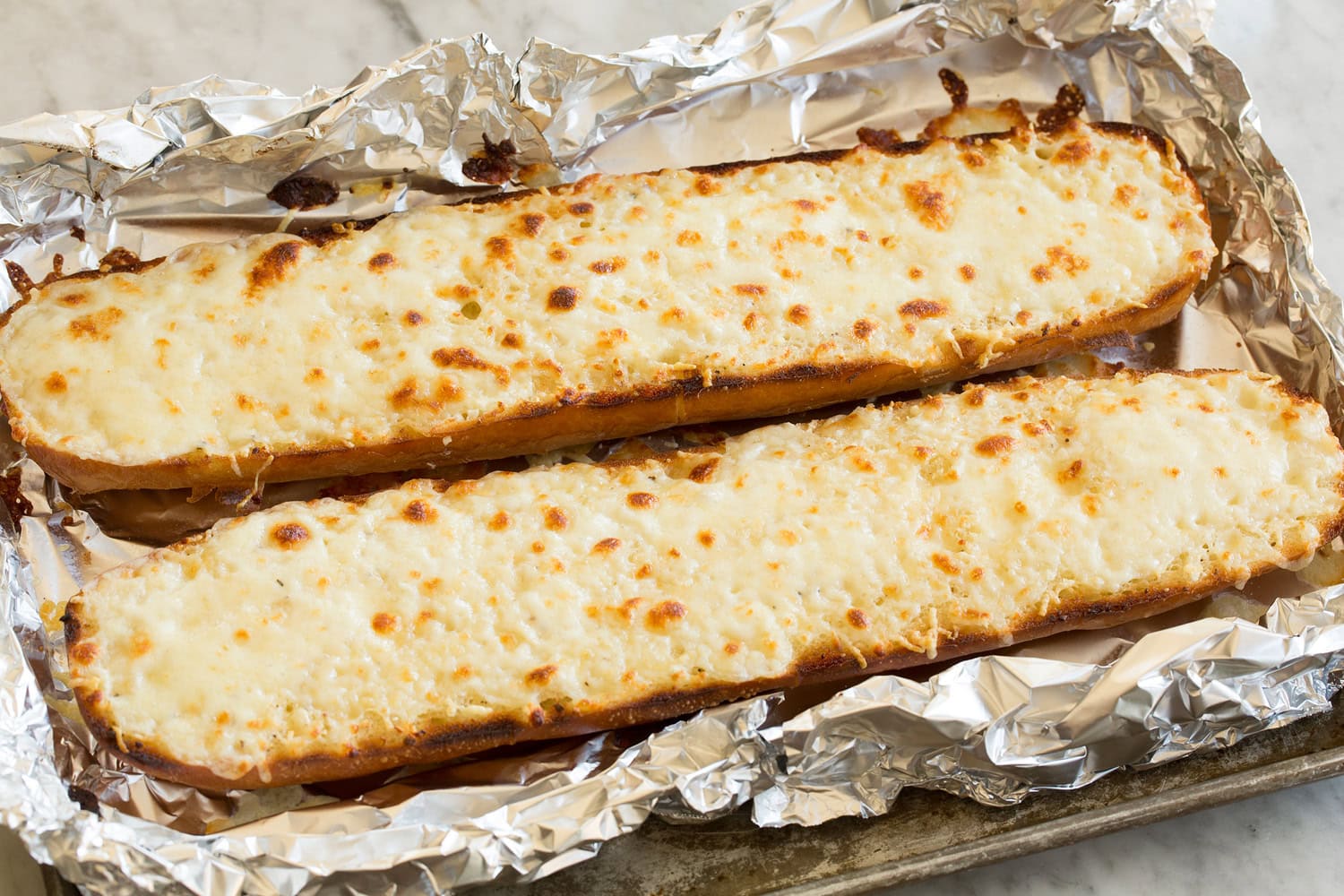 Completed cheesy french bread shown after toasting.
