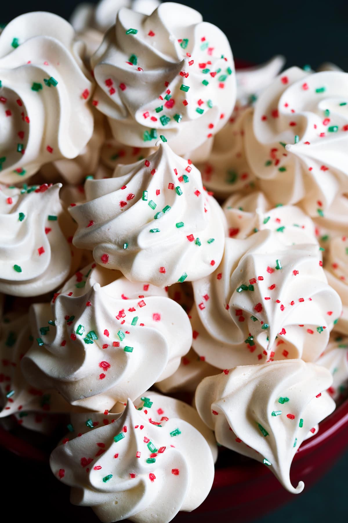 Close up image of stack of homemade meringue cookies.