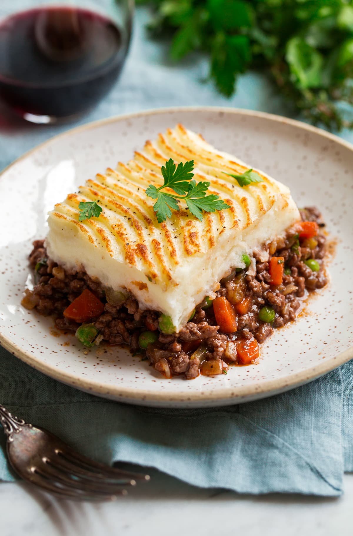 Cut serving of shepherd's pie on a serving plate.