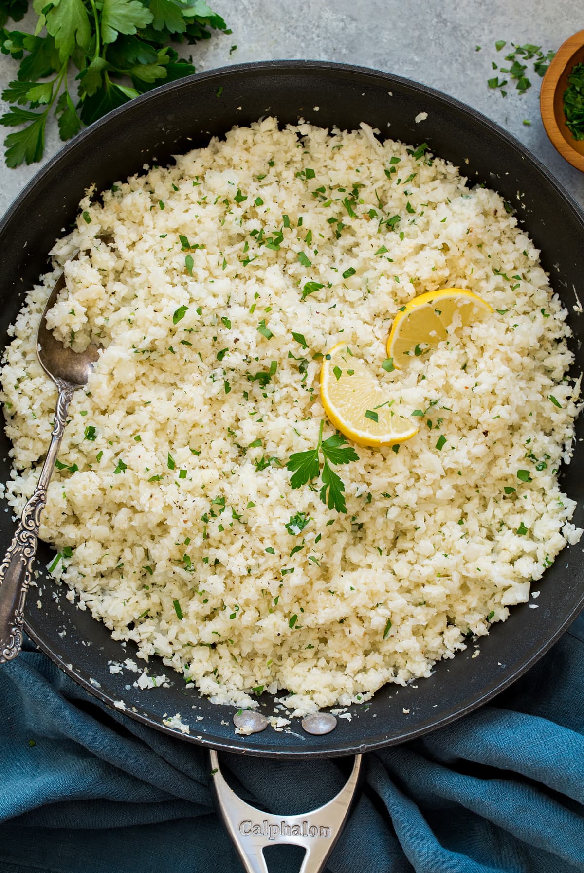 Cauliflower rice shown overhead in a skillet.