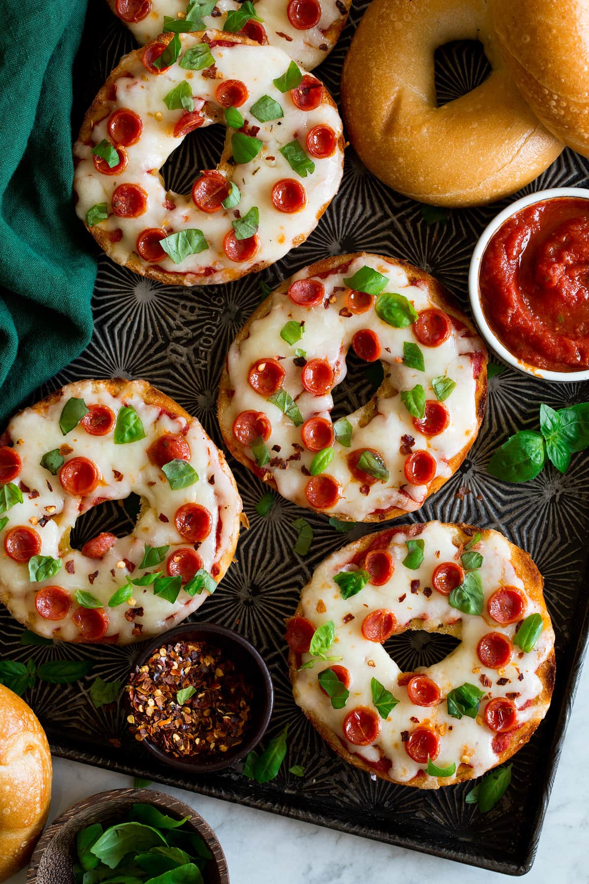 Bagel pizzas shown overhead.